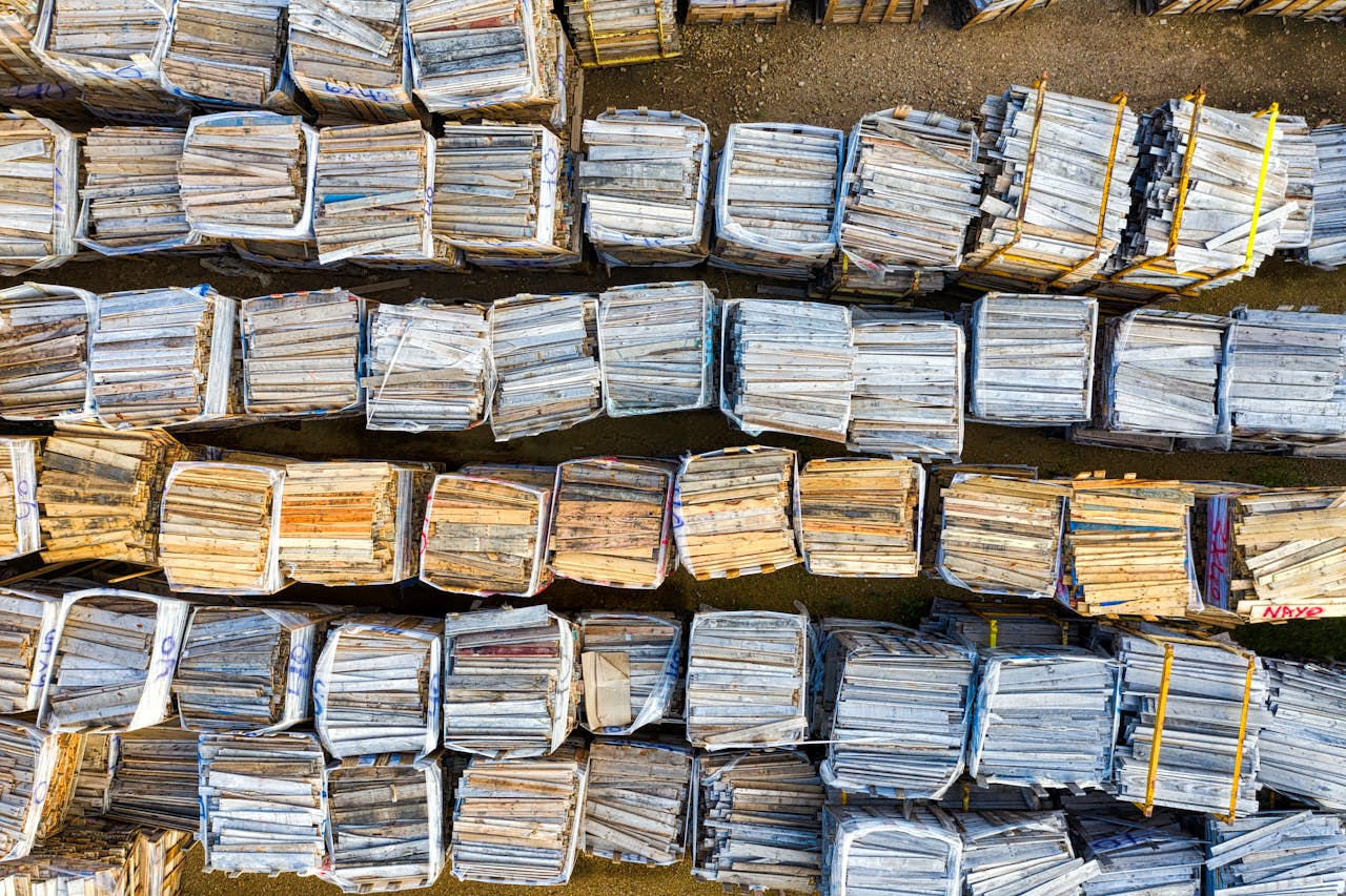 Drone view of neatly arranged wooden pallets at a warehouse in Lake City, MN.